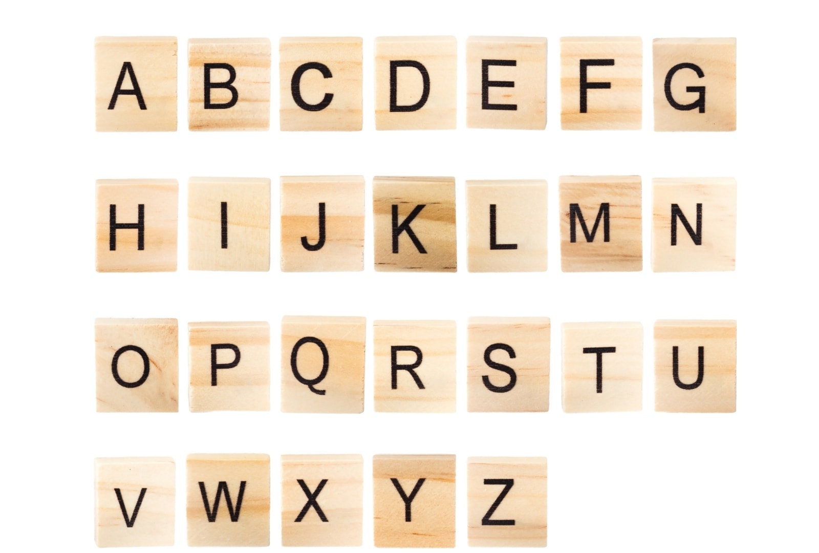 Wooden letter tiles laid out in alphabetical order from A to Z, used for 11 plus verbal reasoning alphabet practice