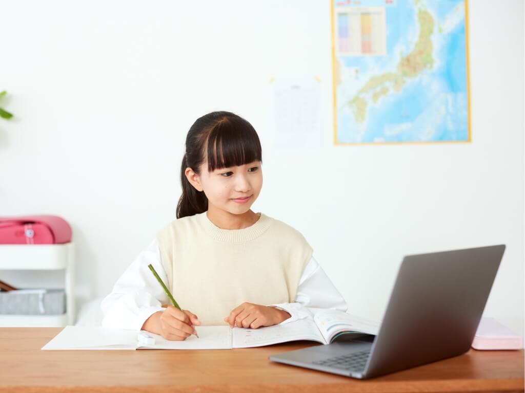 Young child taking online tuition for the year 6 SATs
